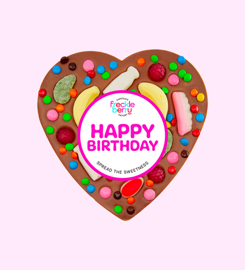 Giant heart-shaped Belgian milk chocolate pizza loaded with colourful lollies, the perfect festive treat to celebrate birthdays.