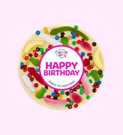 Giant Belgian white chocolate pizza loaded with colourful lollies, the perfect festive treat to celebrate birthdays.
