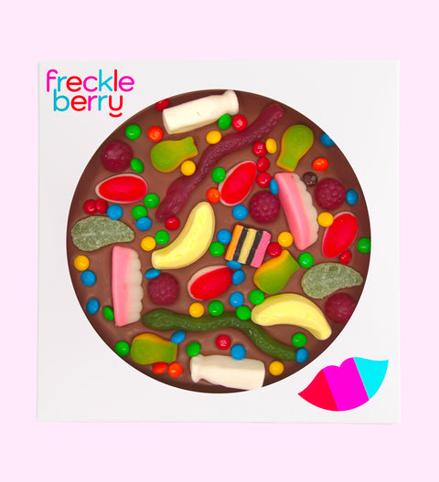 Creamy giant Belgian chocolate pizza (available in 3 variants - dark, milk or white) loaded with colourful lollies, available without a front label for a classic, simple look.