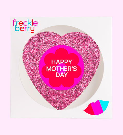 Creamy giant Belgian milk chocolate heart covered in vibrant pink sprinkles with "Happy Mother's Day" label/design, a sweet and thoughtful gift for Mum.