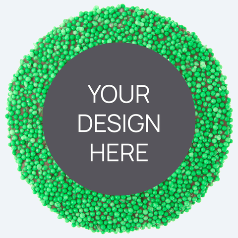 A custom product featuring a single round confectionery item with a colorful sprinkled border and a blank space in the center for a custom label, displayed alongside a selection of other colored sprinkles.