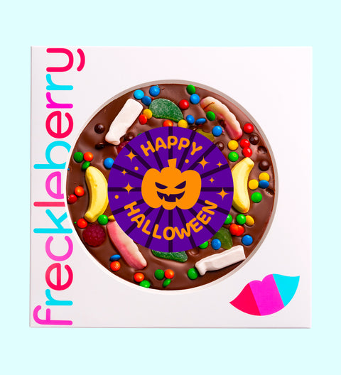 Halloween giant chocolate pizza topped with colourful lollies and sprinkles