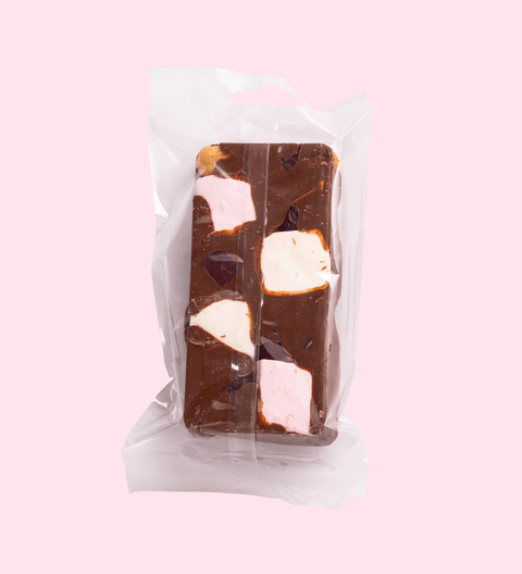 Rich Belgian milk chocolate with roasted hazelnuts, raspberry, marshmallows, caramel fudge, and gluten-free lollies for a decadent treat. 