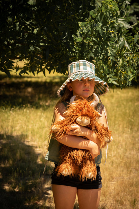 Child with soft, cuddly, and full of charm. A comforting companion and thoughtful gift for kids, animal lovers, and cosy home décor.