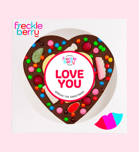 Premium giant Belgian dark chocolate heart pizza loaded with colourful lollies and M&M®s with "Love You" sticker/design - perfect to express love in all occasions. 