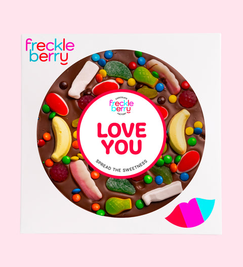 Premium giant Belgian dark chocolate pizza loaded with colourful lollies and M&M®s with "Love You" sticker/design - perfect to express love in all occasions. 