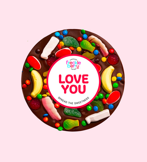 Premium giant Belgian dark chocolate pizza loaded with colourful lollies and M&M®s with "Love You" sticker/design - perfect to express love in all occasions. 