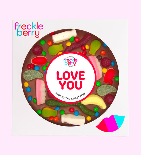 Premium giant Belgian milk chocolate pizza loaded with colourful lollies and M&M®s with "Love You" sticker/design - perfect to express love in all occasions. 