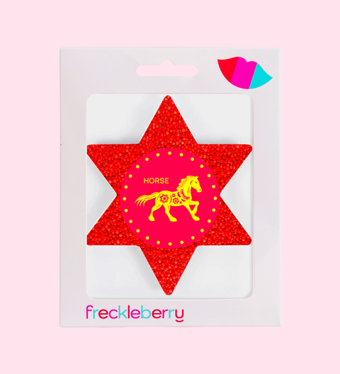 Red star-shaped sticker with horse design and 'freckleberry' luna new year gifts. 