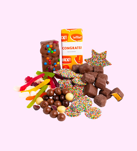 Luxury 'Congratulations' Chocolate Hamper
1 x Luxury White Gloss Hamper Gift Box
1 x Freckle Star
1 x Premium Milk Chocolate 'Congrats' Block,
1 x 200g Milk Chocolate Freckles
1 x 200g Mixed Chocolate Raspberries
1 x 200g Lolly Jumble
1 x 200g Chocolate Honeycomb
1 x Fun Rocky Road
1 x Option to Add: 'Congrats To You' Message on Hamper