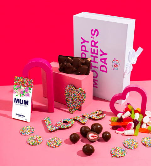 Luxury Mother's Day Hamper - White Gloss Hamper, Happy Mother's Day sticker, Dark Freeze dried strawberries, Giant heart freckle or giant heart lolly pizza, Belgian chocolate block in plain or freckle, Sweet Treat dark freckles bag, Dark rocky road, Mum word, Biscoff, caramel and sea salt heart shape
