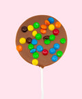 Creamy Belgian milk chocolate pop topped with colourful M&Ms