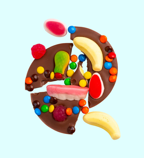 Premium Belgian milk chocolate mini pizza topped with a fun mix of colourful lollies – a sweet treat perfect for gifting or indulging.