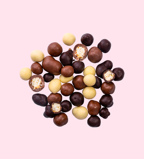 Crunchy caramel popcorn coated in dark, milk, and white Belgian chocolate for the ultimate sweet snack.