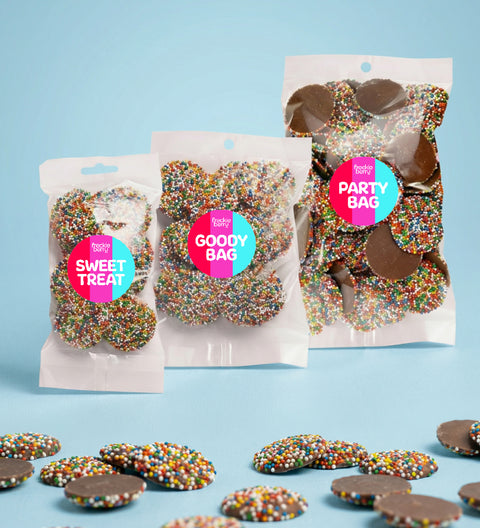 Bags of Mixed Milk Chocolate Freckles, made from smooth premium Belgian chocolate and topped with colourful sprinkles – a fun and tasty treat for any occasion.