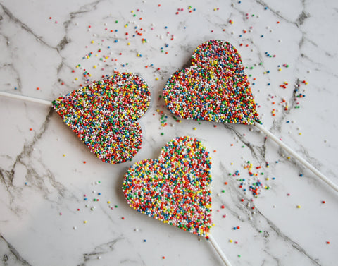 Creamy Belgian chocolate heart pop (available in 3 variants - dark, milk or white) covered in colourful sprinkles, a sweet and thoughtful gift to celebrate special occasion.