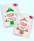 Two Christmas-themed pins in packaging with 'freckleberry' branding. Corporate Branding