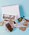Carefully curated hamper which includes Belgian chocolate Freckle House, “SOLD” freckle, rocky road, freckles & a celebration drink — beautifully boxed. Handcrafted in Geelong.