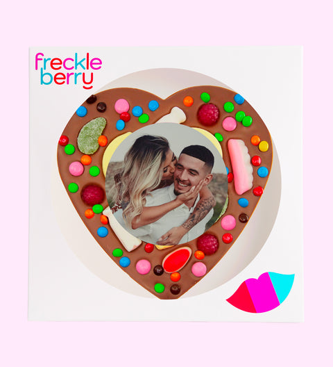 Premium Belgian chocolate heart pizza (available in 3 variants - dark, milk or white) topped with colourful lollies, customised with your uploaded image for a fun and unique gift.