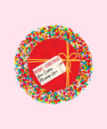 Creamy Belgian milk chocolate with colourful sprinkles, customised with a festive red present design and personalised message for holiday gifting.