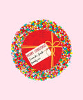 Creamy Belgian milk chocolate with colourful sprinkles, customised with a festive red present design and personalised message for holiday gifting.