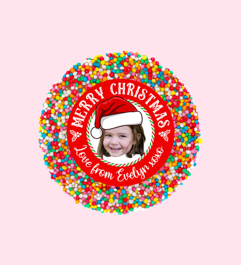 Creamy Belgian chocolate (available in 3 variants - dark, milk or white) topped with colourful sprinkles, customised with a festive Santa hat design for holiday gifting.