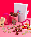 Premium Belgian chocolates customised with your photo and heartfelt text for an unforgettable gift Inclusions:

1 x Personalised Labelling
1 x Luxury White Gloss Hamper Gift Box
1 x Freckle Heart – Milk Chocolate
1 x Freckle Word Love – Milk Chocolate
1 x Cookies &amp; Cream White Belgian Chocolate Block
1 x 200g Milk Chocolate Freckles
1 x 130g Milk Chocolate Freeze-Dried Strawberries
1 x 200g Lolly Jumble
1 x Milk Rocky Road