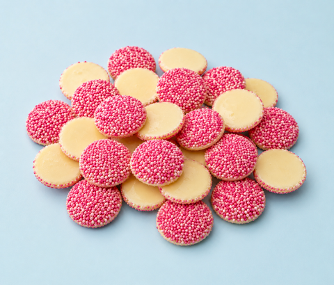 White premium chocolate with pink freckles. Perfect for baby showers to show boy or girl or gender reveal. 