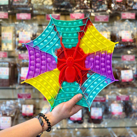 Reusable sensory spider web pop it toy perfect for Halloween. Great for stress relief, fidgeting, and festive play for all ages.