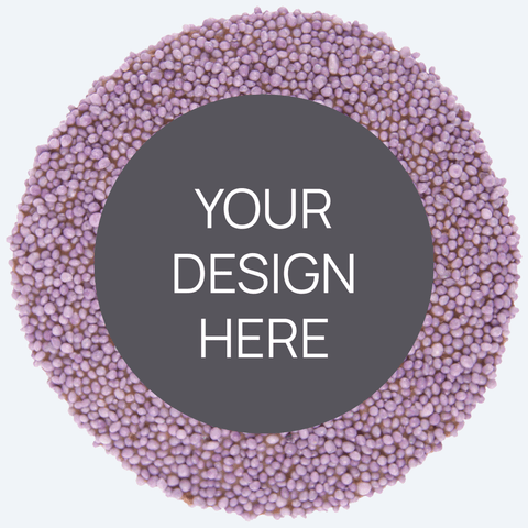 A custom product featuring a single round confectionery item with a colorful sprinkled border and a blank space in the center for a custom label, displayed alongside a selection of other colored sprinkles.