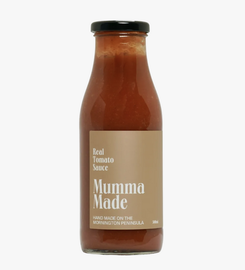 Bottle of 'Mumma Made' real tomato sauce on a white background