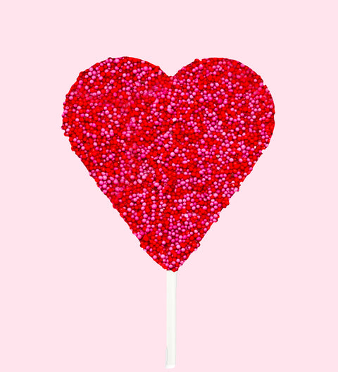 Creamy Belgian chocolate heart pop (available in 3 variants -dark, milk or white) covered in red and pink sprinkles, the perfect sweet gift to express your love.