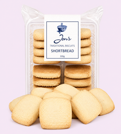 A package of Jen's Traditional Biscuits Shortbread with several golden-brown shortbread cookies displayed in front on a light lavender background.