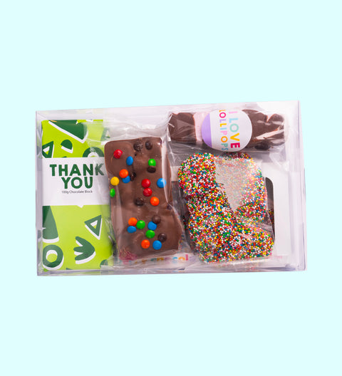 Thank You Gift Box, filled with a selection of premium Belgian chocolate treats – a delicious way to say thanks. Inclusions:

100g Milk Chocolate Message Block
150g Fun Rocky Road
150g Milk Chocolate Speckles Grab Bag
60g Marshmallow Pop
60g Chocolate “Thanks” Word