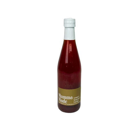 Bottle of 'Mumma Made' lemon & strawberry cordial on a white background