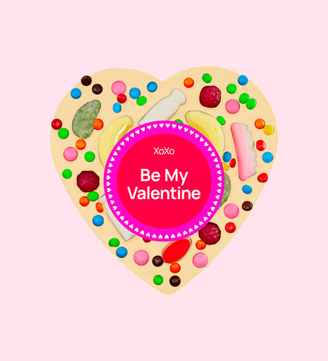 Giant heart-shaped premium Belgian white chocolate topped with colourful lollies and wrapped with a cheerful Be My Valentine sticker – a fun and delicious gift for someone special this valentine's day.