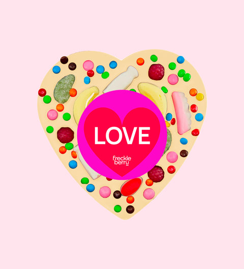 Giant heart-shaped premium Belgian white chocolate topped with colourful lollies and wrapped with a cheerful Love sticker – a fun and delicious gift for someone special this valentine's day.