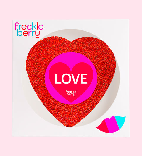 Giant red freckle heart, made from premium Belgian chocolate and topped with vibrant red sprinkles wrapped in a Happy Valentine’s Day design (with Love sticker) for the perfect romantic treat.