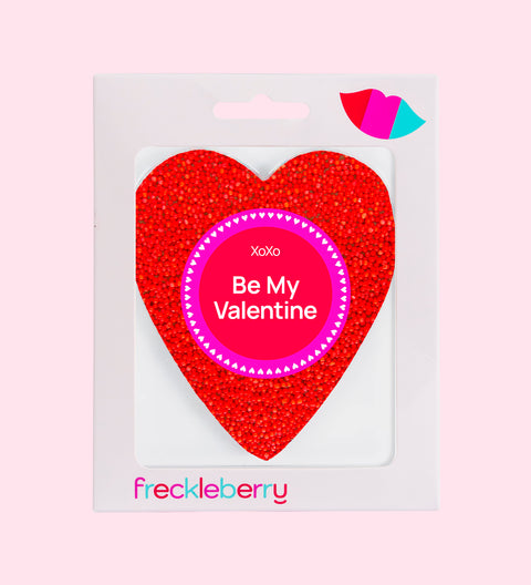 Premium Belgian chocolate heart topped with vibrant red sprinkles, wrapped in Be My Valentine sticker/design – a sweet gift for someone special.