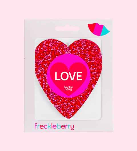 Premium Belgian chocolate (available in 3 variants - dark, milk or white) topped with vibrant red and pink sprinkles, wrapped in "Love" design/label – a sweet gift for someone special.