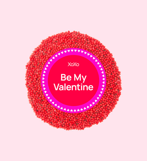 Premium Belgian chocolate topped with bright red sprinkles, wrapped in a sweet Be My Valentine design – perfect for gifting.