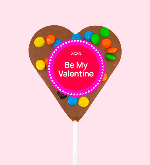 Creamy Belgian milk chocolate heart pop topped with colourful M&M®s with "Be My Valentine" label/design - a sweet way to share the love.
