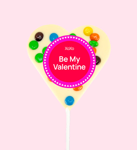 Creamy Belgian white chocolate heart pop topped with colourful M&M®s with "Be My Valentine" label/design - a sweet way to share the love.