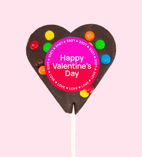 Creamy Belgian dark chocolate heart pop topped with colourful M&M®s with "Happy Valentine's Day" label/design - a sweet way to share the love.