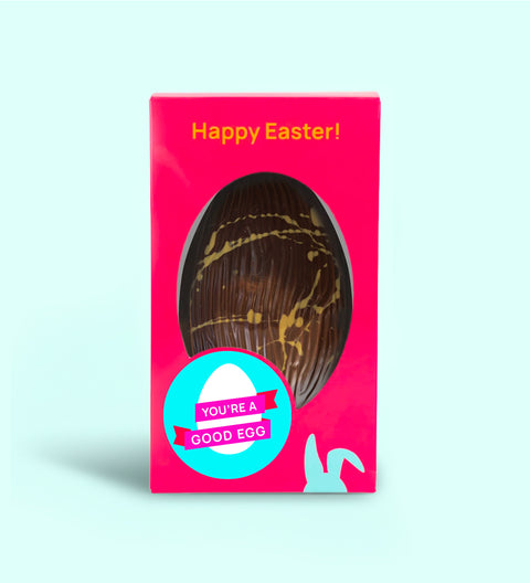 Close-up of caramel crunch Easter egg with Murray River salt on glossy chocolate