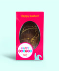 Caramel crunch and sea salt Easter egg styled with scattered caramel pieces and salt