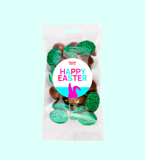 Mini half Belgian chocolate eggs with green sprinkles. Delicious 100% Belgian chocolate easter eggs with happy easter bunny sticker