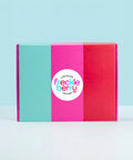 Colorful hamper gift box with 'Freckle Berry' logo on a light blue background