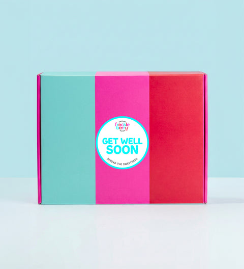 Colorful hamper gift box with a 'Get Well Soon' sticker on a light blue background
