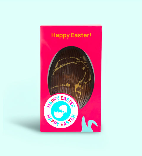 Belgian chocolate yuzu and hazelnut Easter egg with yellow citrus drizzle